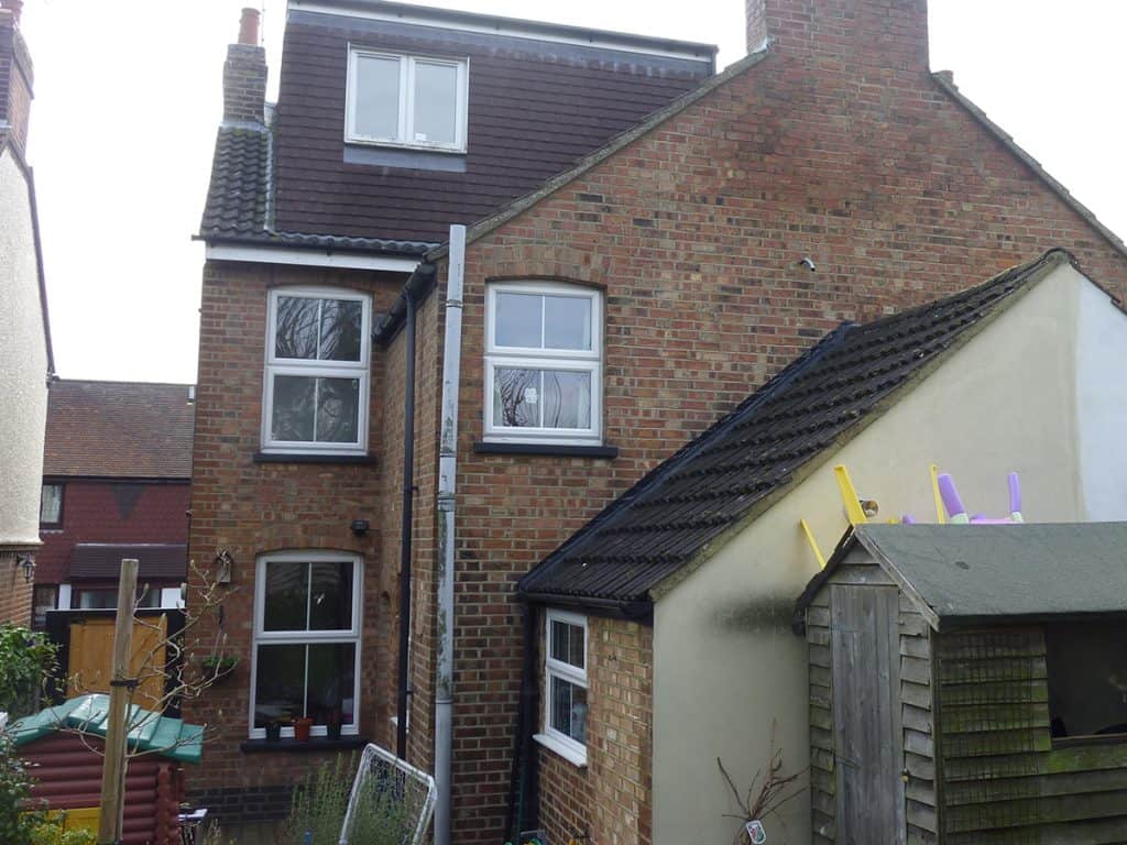 Rear of the Harpenden brick house before the conservatory kitchen extension