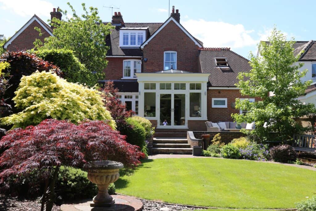 New white orangery at the rear of the Harpenden house, viewed from the garden