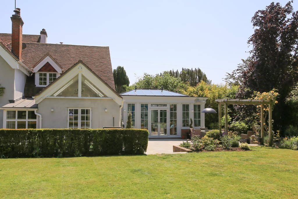 Wide garden view of the house and completed Amersham orangery