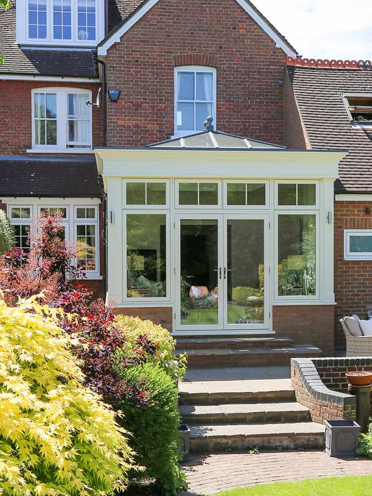 Harpenden replacement orangery with glazed doors and garden steps