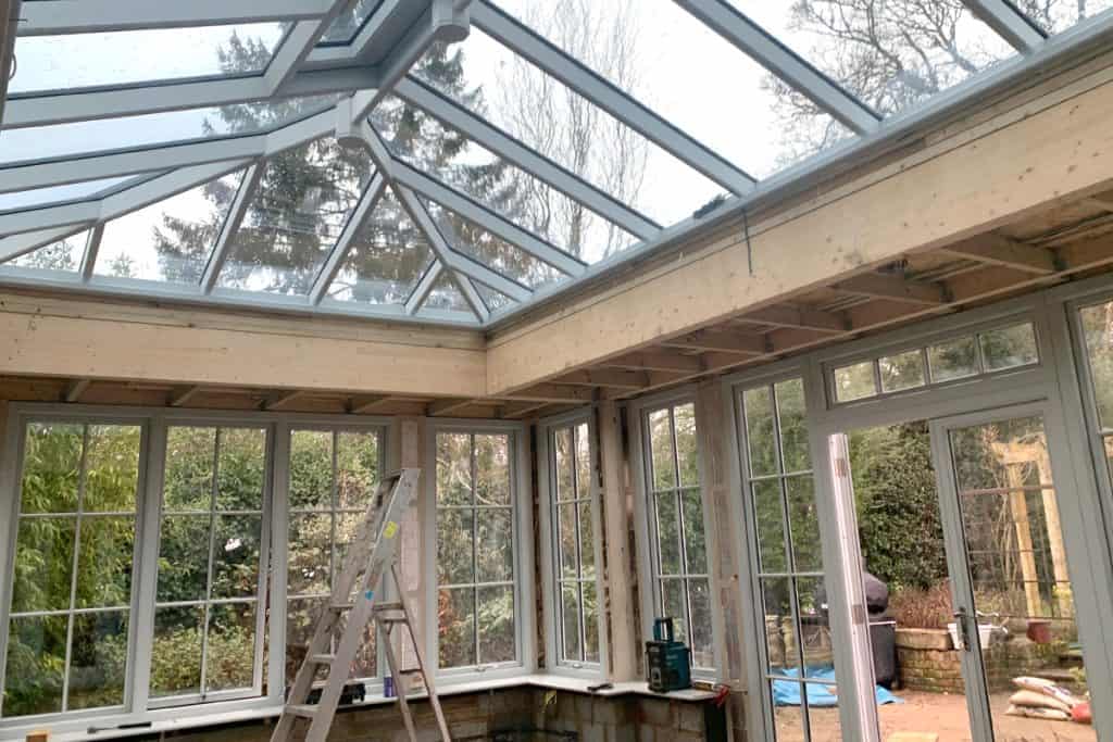 Glazed roof lantern and painted windows inside the orangery during construction