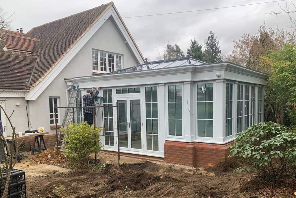 New orangery glazing and roof lantern fitted while exterior work continues