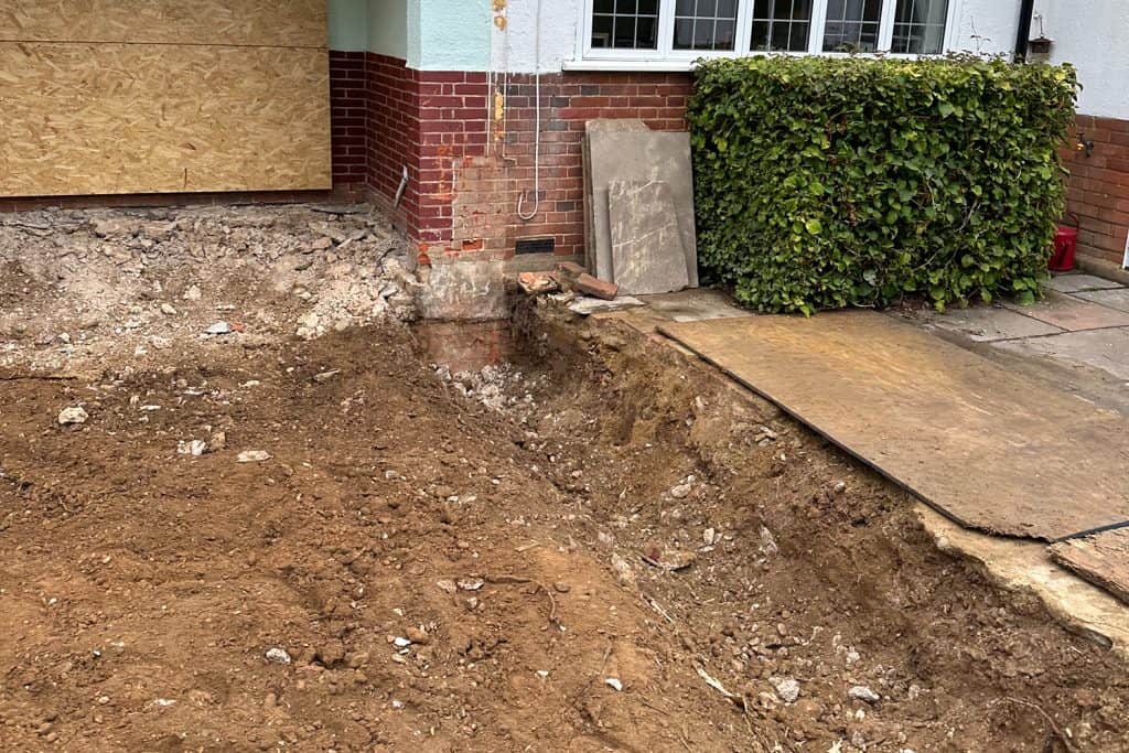 Excavated foundations for the new orangery beside the protected patio