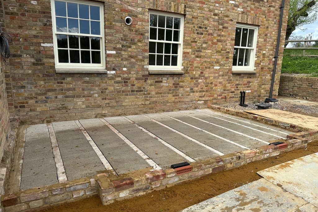 Beam-and-block floor and reclaimed brick base for the new garden room