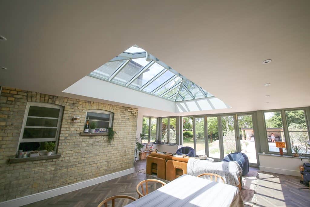 Finished orangery interior with roof lantern and doors opening to the garden