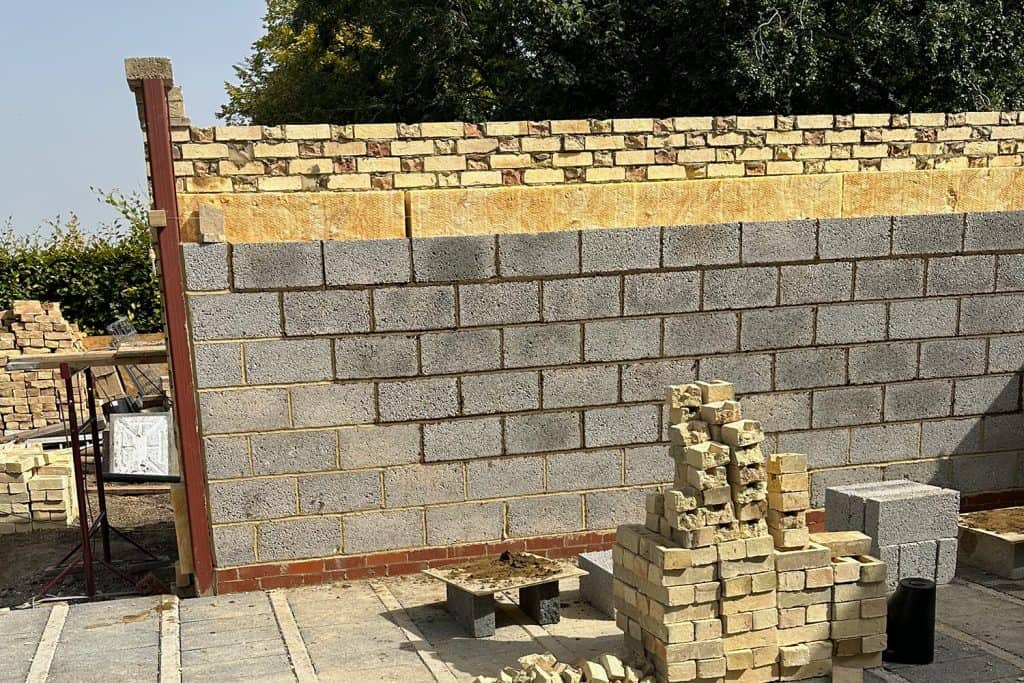New orangery wall with Arlesey White brickwork and matching plinth