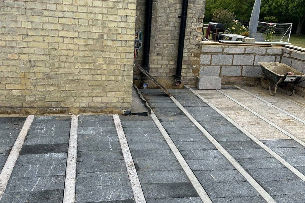 Block-and-beam floor beside the rising orangery brick walls