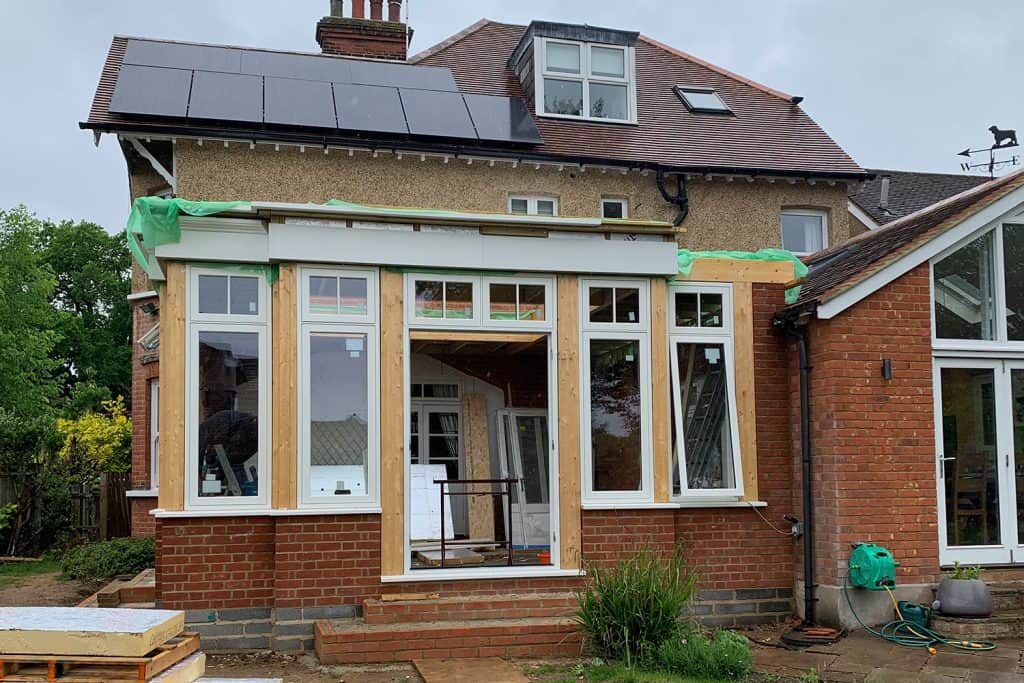 New timber windows and double doors fitted between the orangery posts