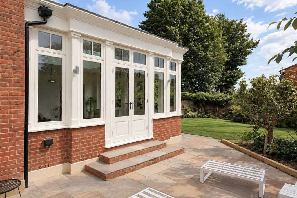 Finished orangery doors and brick steps opening onto the new patio
