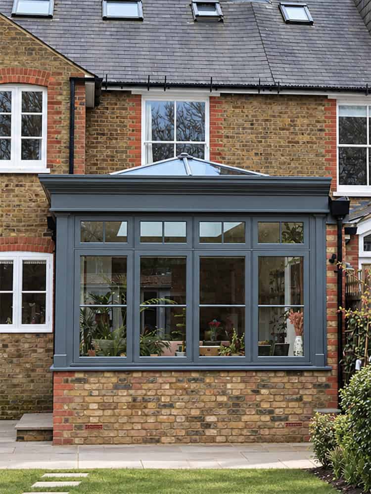 St Albans orangery with dark grey fascia, stock brick base and roof lantern