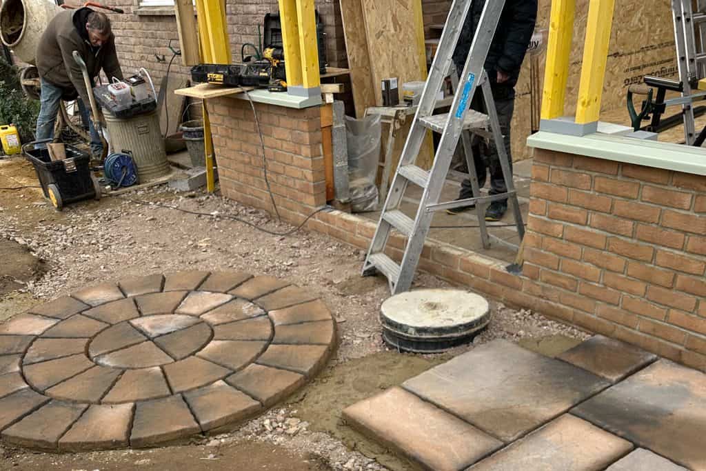 New paving and circular patio feature being laid beside the orangery